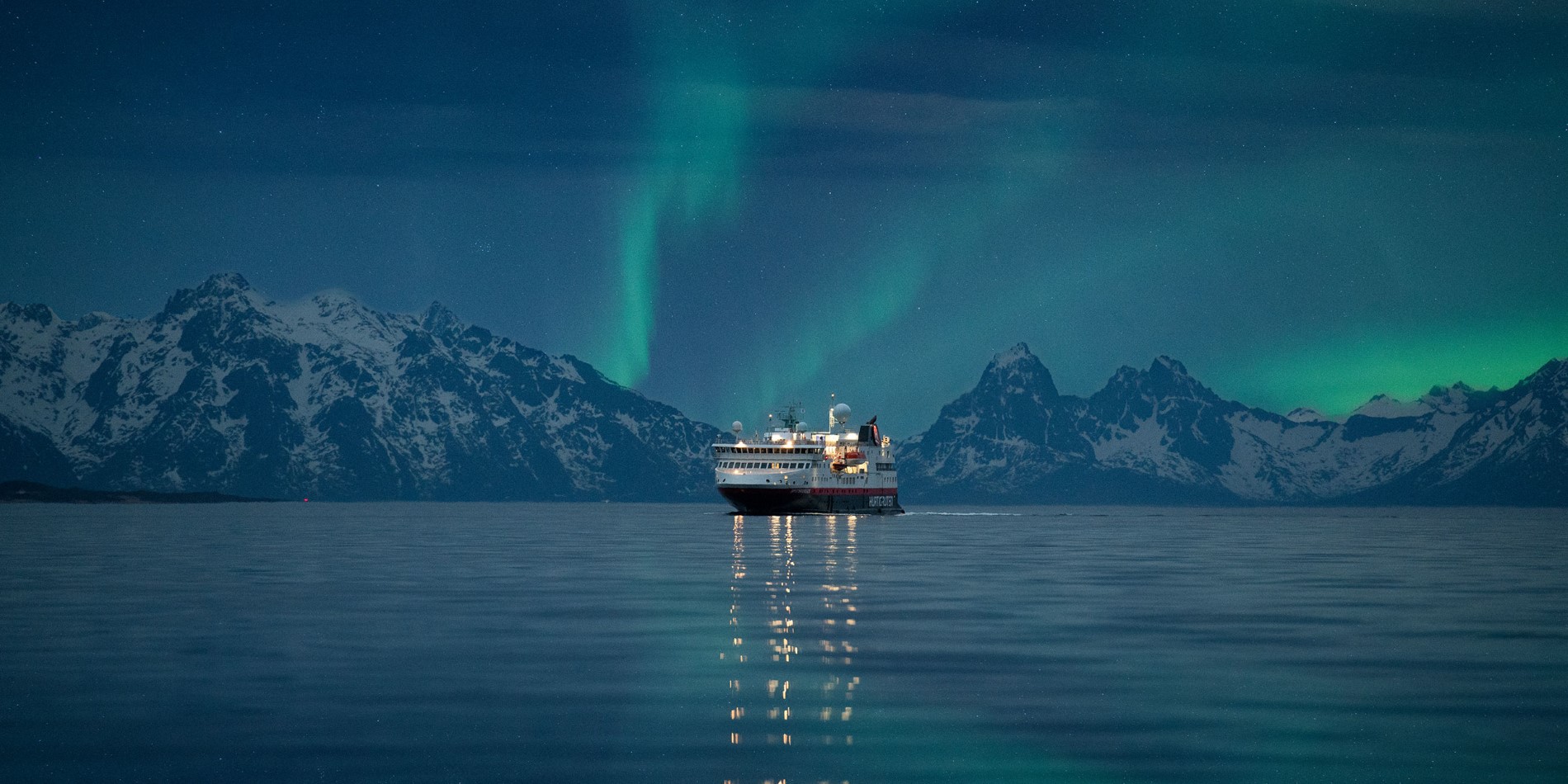 Exterior view of MS Spitsbergen under the Northern Lights - Photo Credit: Hege Abrahamsen